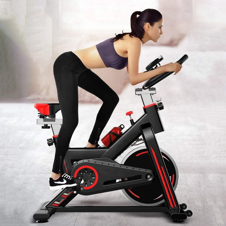 Ultra-Quiet Cardio Exercise Bike with LCD Display - Stationary Spin Bike for Home Fitness - Adjustable Resistance Levels - Built-in Tablet Holder - Belt-Driven System - Comfort Padded Seat -